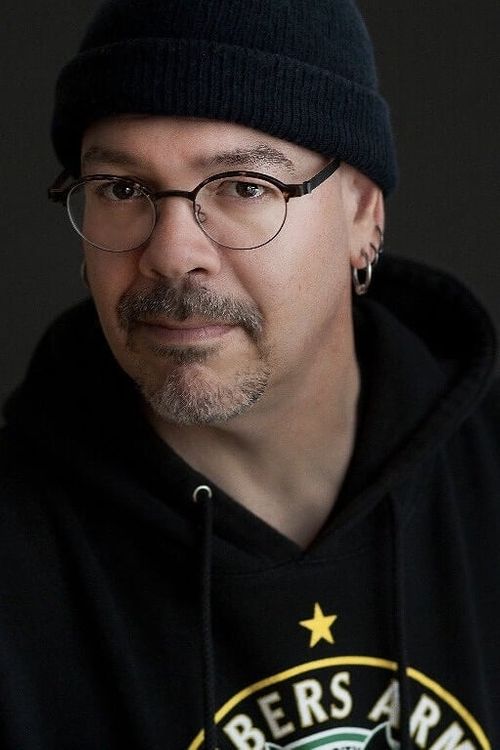 Key visual of Greg Rucka